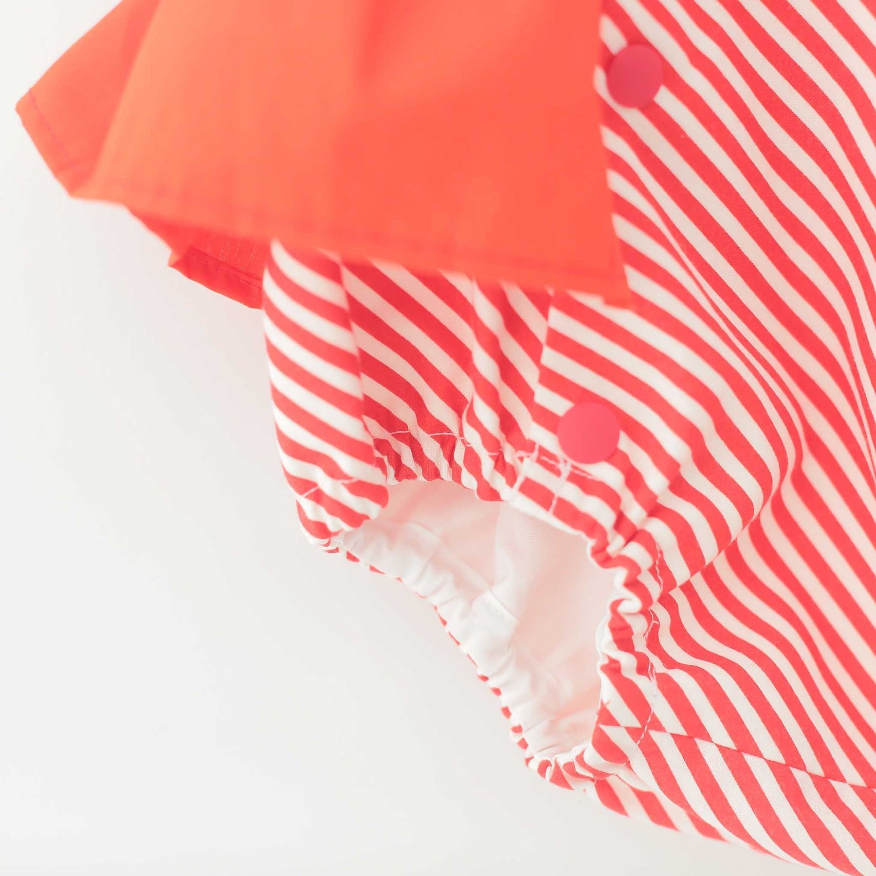 マンダリンレッドのストライプロンパース - heartmelt こども衣装レンタルこども衣装レンタル